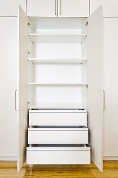 Built-in cabinet in room of an unoccupied newly-built apartment.