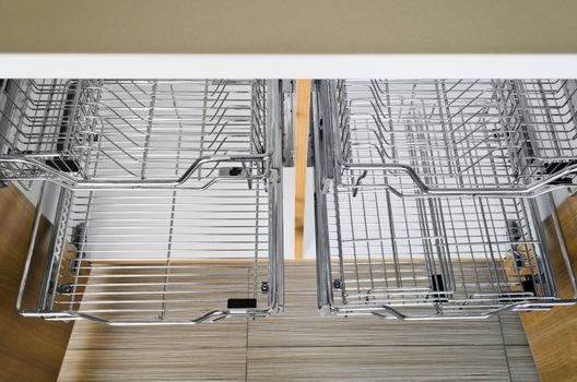 Open kitchen cabinet with two layers of stainless dish rack