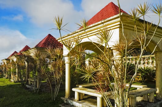 A line of gazebos in a formal garden