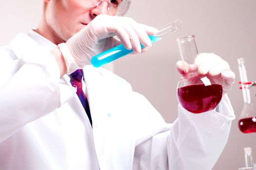 chemist working in the laboratory, mix liquid