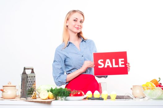woman holding a plate with an inscription Sale