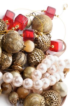 Arrangement of Jewelry with Gold Bracelets, Ruby Necklace and Pearl closeup on white background