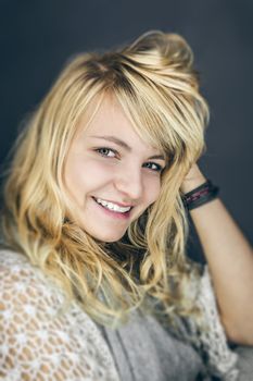 An image of a beautiful smiling blond girl