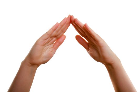 Female hands in the form of the roof is isolated on a white background