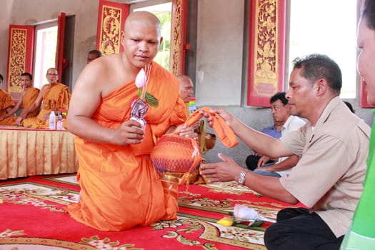 NAKON SI THAMMARAT, THAILAND - NOVEMBER 17 : Newly ordained Buddhist monk  worship parents in Buddhist ordination ceremony on November 17, 2012 in Nakon Si Thammarat, Thailand.