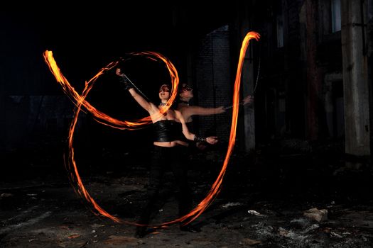 Woman holds in his hand the fire
