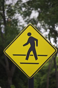 walking sign in the yellow background
