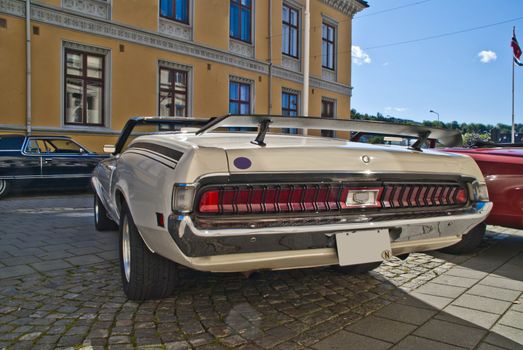 american classic cars, 1970 mercury cougar xr7 convertible, image is shot in august 2012 in halden center, during the summer months every wednesday there is a meeting of classic cars in halden