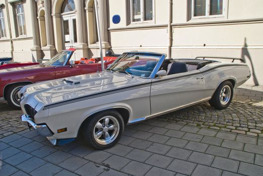 american classic cars, 1970 mercury cougar xr7 convertible, image is shot in august 2012 in halden center, during the summer months every wednesday there is a meeting of classic cars in halden