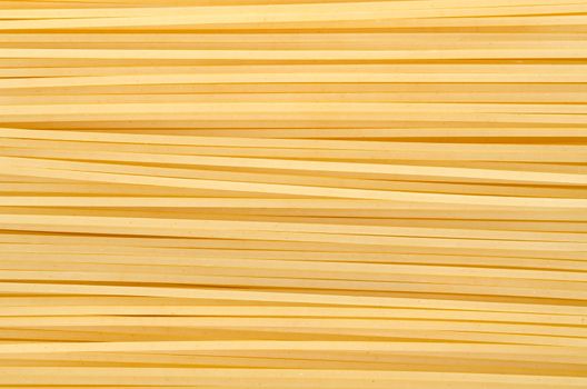 Photo of the yellow raw pasta background