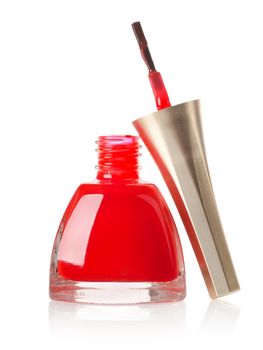Red nail polish and brush isolated on a white background