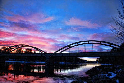 A silhouette of a bridge in Twilight light