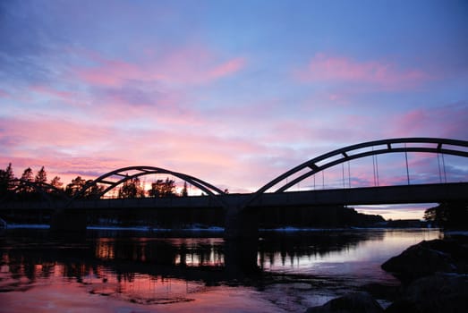 A silhouette of a bridge in Twilight light