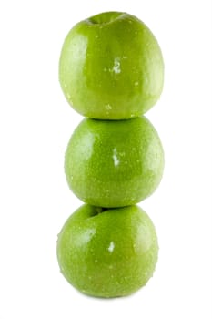 three green apples on a white background