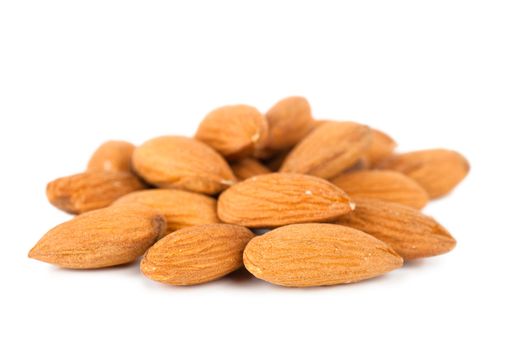 Closeup view of almonds over white background