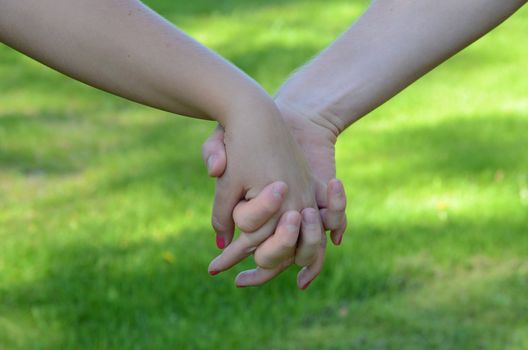 A love couple holding each other's hands