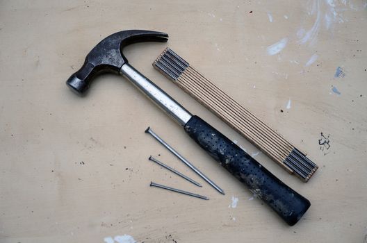 Hammers, nails and yardstick