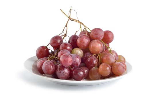 Grapes in a plate isolated on white background