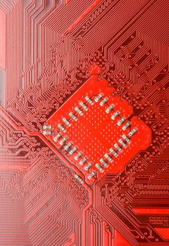 Red circuit board close-up. Electronic background