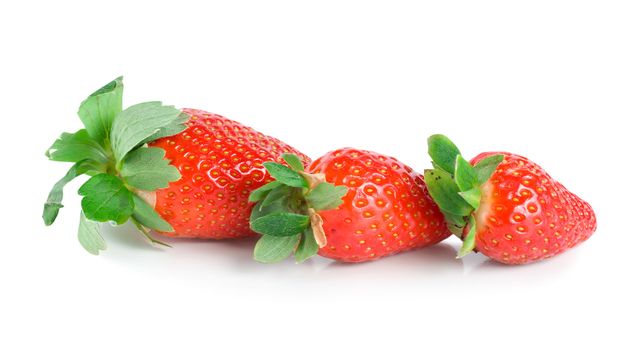 Juicy strawberries isolated on a white background