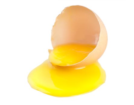 Broken egg with a yellow yolk isolated on white background