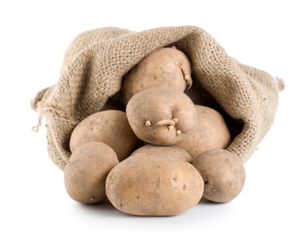 Raw potatoes in a hessian sack isolated on a white background