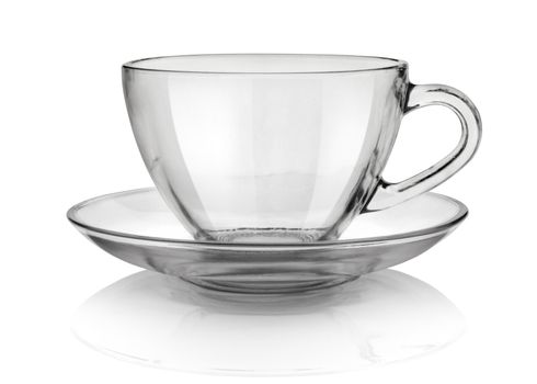 Glass cup and saucer isolated on white background