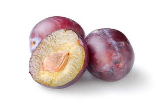 Three plums isolated on a white background