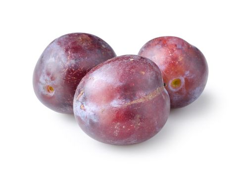 Three plums isolated on a white background