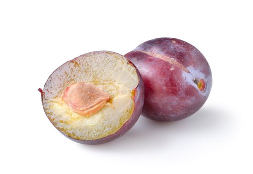 Two plums isolated on a white background