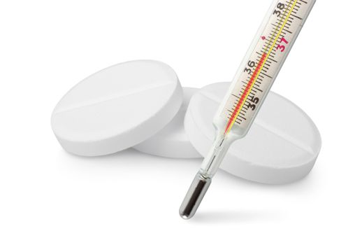 Thermometer and tablets isolated on a white background