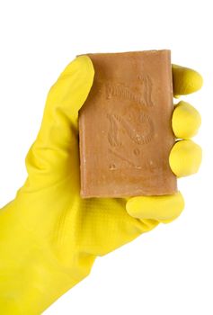 Yellow cleaning glove with a soap on a white background