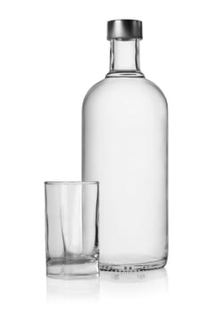 Bottle and glass of vodka isolated on a white background