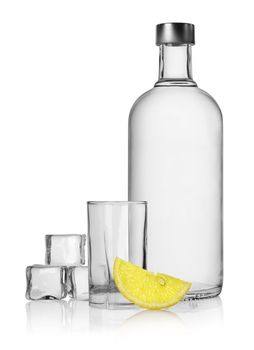 Bottle of vodka and lemon isolated on a white background