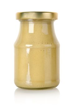 Glass jar of mustard isolated on a white background