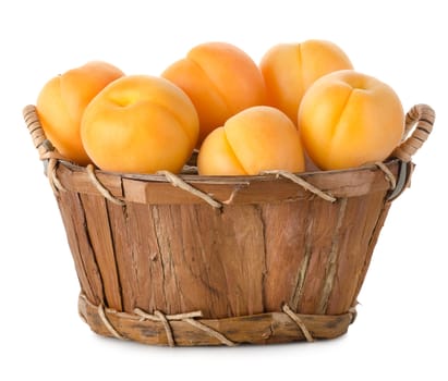 Apricots in a basket isolated on a white background