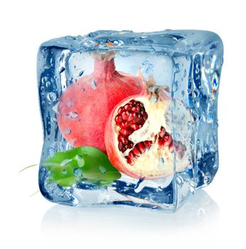 Ice cube and pomegranate isolated on a white background