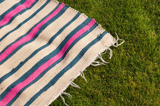 colorful picnic blanket on the grass field