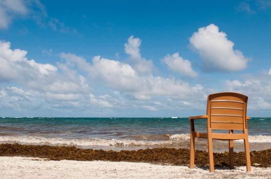 singular chair at the beach in Vieux Fort, Saint Lucia (conceptual picture for vacations or retirement)