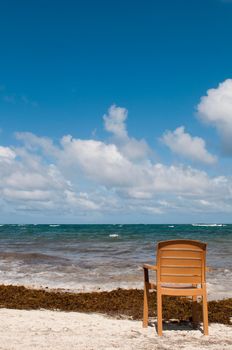 singular chair at the beach in Vieux Fort, Saint Lucia (conceptual picture for vacations or retirement)