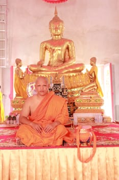 NAKON SI THAMMARAT, THAILAND - NOVEMBER 17 : Newly ordained Buddhist monk take photo in Buddhist ordination ceremony on November 17, 2012 in Nakon Si Thammarat, Thailand.
