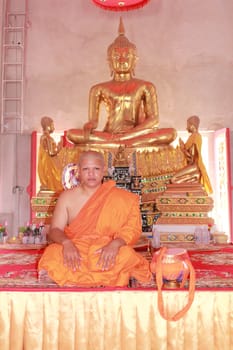 NAKON SI THAMMARAT, THAILAND - NOVEMBER 17 : Newly ordained Buddhist monk take photo in Buddhist ordination ceremony on November 17, 2012 in Nakon Si Thammarat, Thailand.