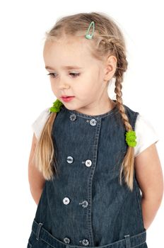 Portrait of cute girl in denim dress in studio