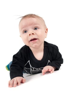 Baby boy lying on white background