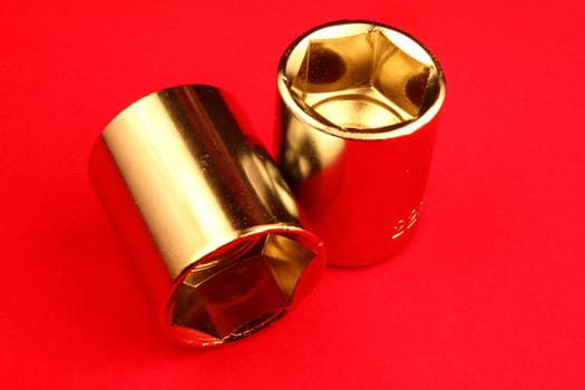 Two sockets on red background.