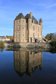 a castle with its moats, its park and garden with its towers and its ancient architecture