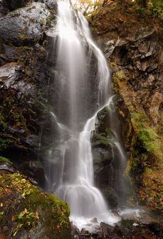 scenic waterfall Urami in Nikko, Japan at late autumn season; focus on waterfall