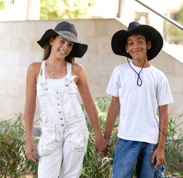 Boy and girl walking through the park.