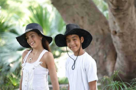 Boy and girl walking through the park.