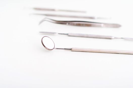 collection of medical instruments, on a light background